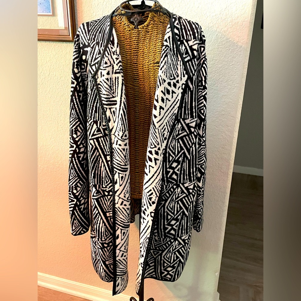 CATO XL black and white geometric sweater jacket with black piping.